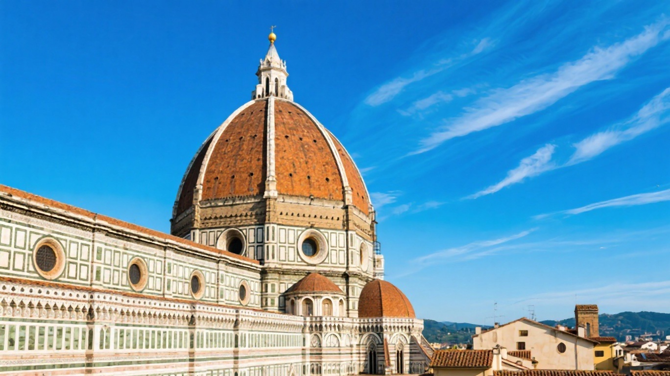 Florence's Cathedral dome designed by Brunelleschi against a blue sky
